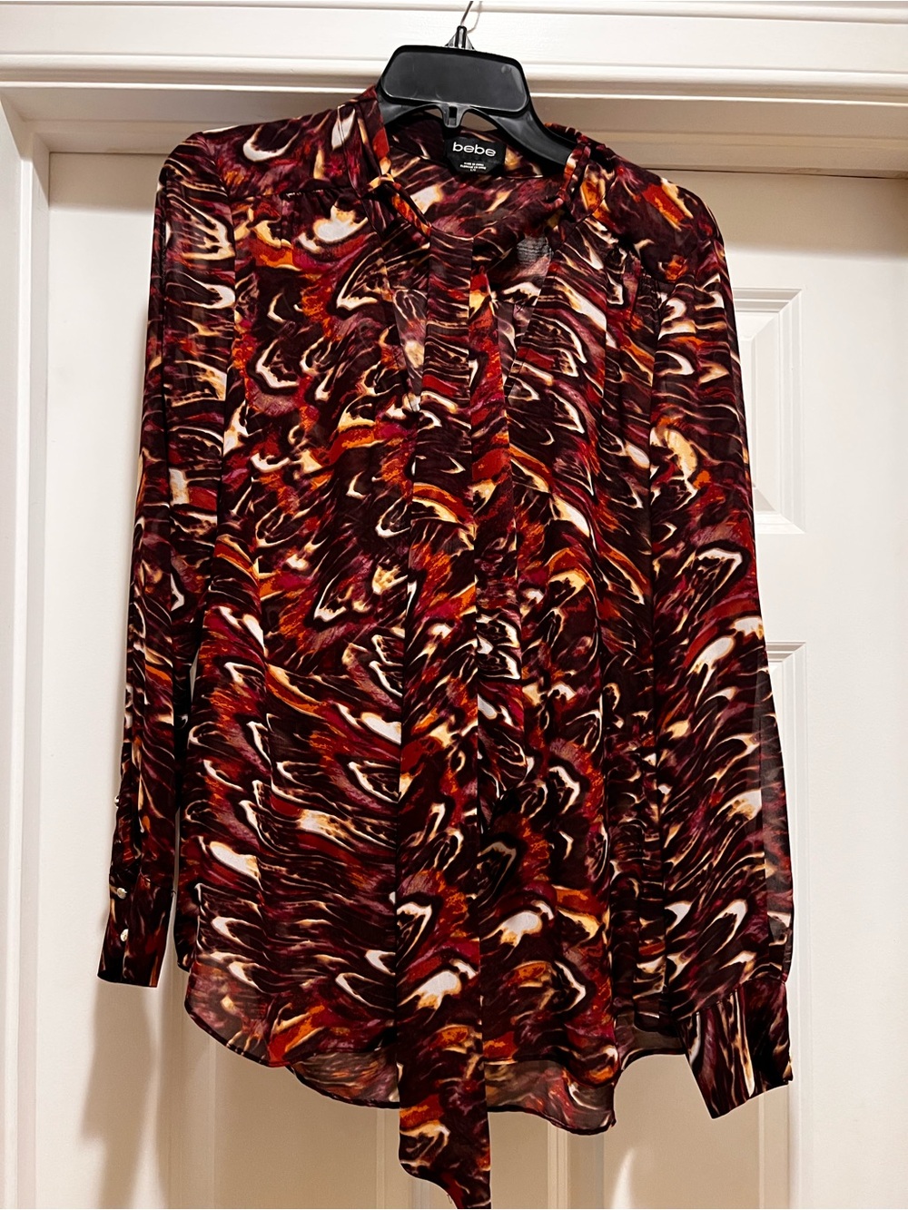 bebe Marbled Burgundy Red Tie-Neck Blouse with gold buttons